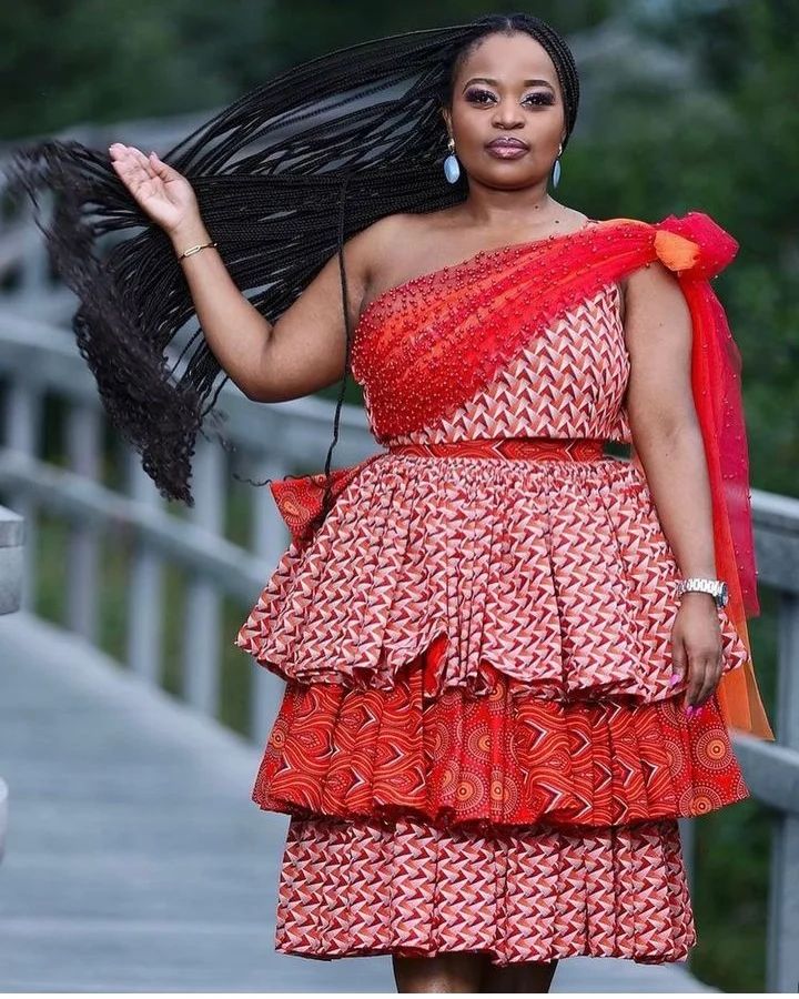 Beautiful 1 sleeve layered Red Shweshwe Dress with Tulle
