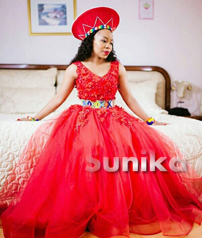 Zulu Bride In Sleeveless Red Ball Gown With Beaded Belt and Red Isicholo Hat