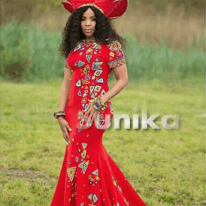 Zulu Bride In Red Print Dress Red Isicholo Hat and Zulu Beads Zulu Bride In Red Print Dress Red Isicholo Hat and Zulu Beads