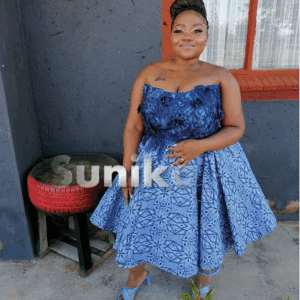 Plus size shweshwe dress with lace and flowers