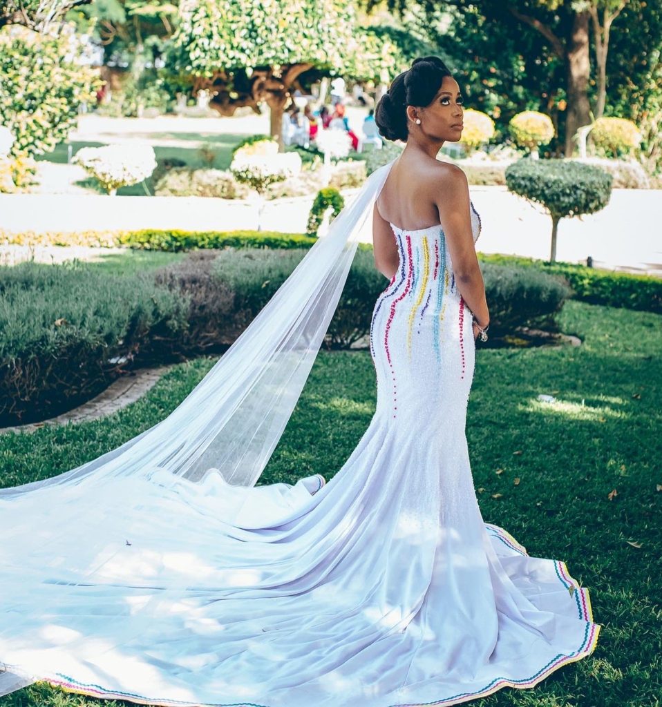 Beaded Traditional white wedding dress by Bayanda Khantini
