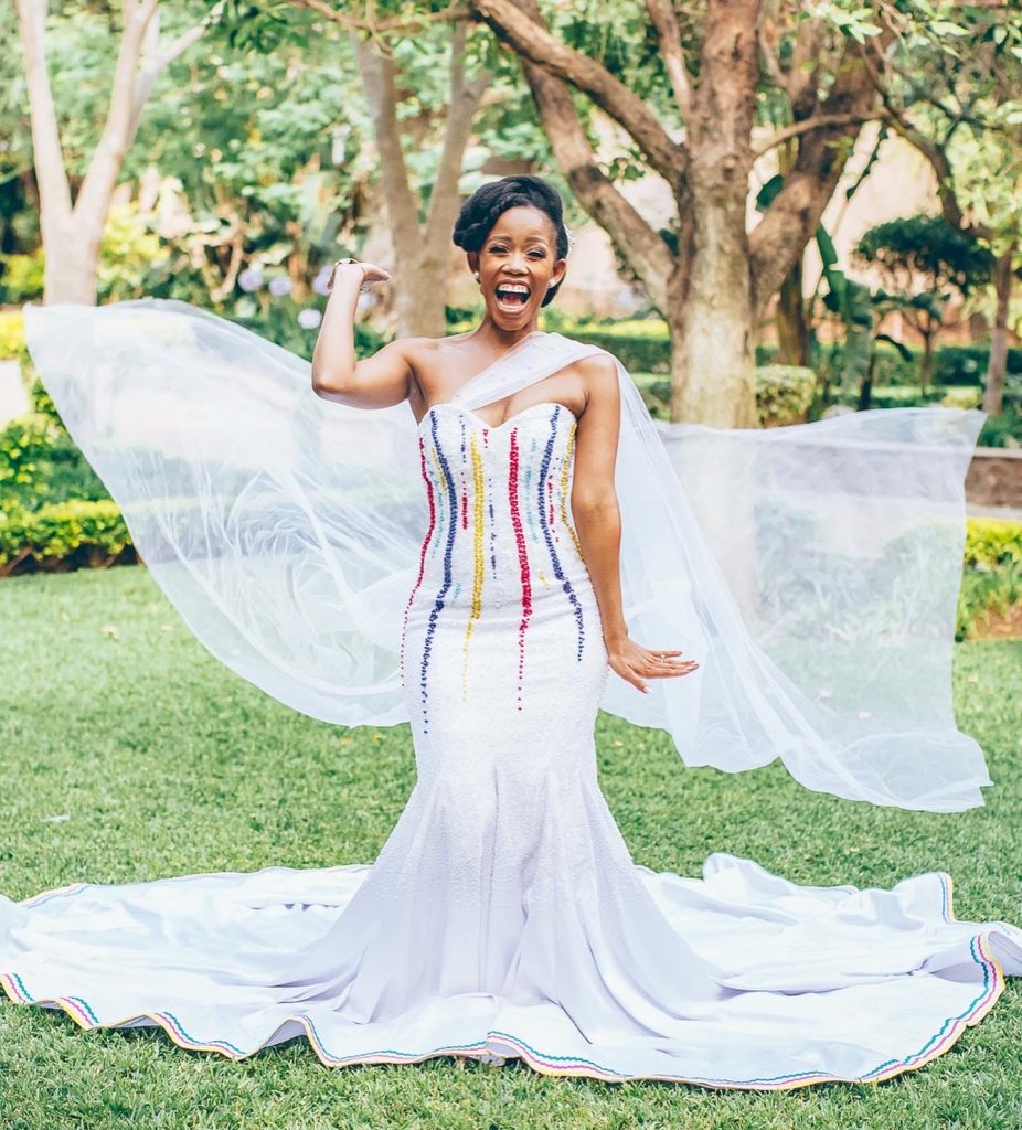 Beautiful white beaded wedding dress by Bayanda Khantini