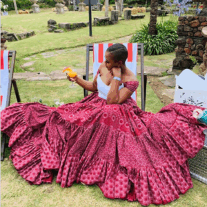 Burgundy flared Shweshwe dress by Indoni Fashion House