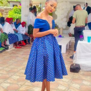 Drop Shoulder Shweshwe Dress with v neck by by Traditional attire Shweshwe dresses Drop Shoulder Shweshwe Dress with v neck by by Traditional attire Shweshwe dresses